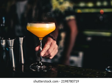 Man Hand Bartender Holding Cocktail In Glass On The Bar Counter