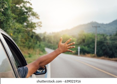 Man Hand At The Car Window On An Empty Country Road