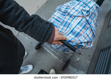 Man Hand Carrying Large Bazar Bag For The Thrift Shop, Charity, Cleaning Space Concept. Outdoors, Closeup, Top View