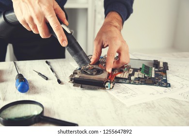 man hand computer processor with a vacuum cleaner - Shutterstock ID 1255647892