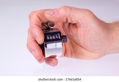 Man hand with counter clicker- isolated in white
