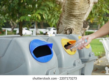 man hand discarded plastic bottle in waste sorting bin after workout.concept for outdoors exercise,plastic water bottle drinking impact,campaign recycling waste sorting to reduce global warming  - Shutterstock ID 2207173273