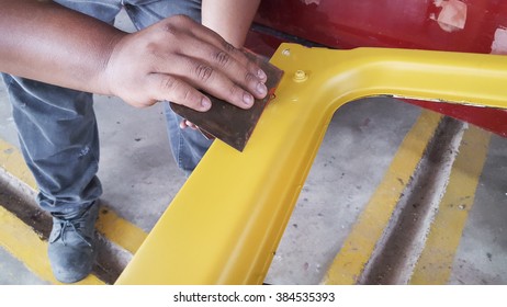 Man hand do some patch for painting old car part