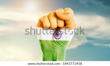 Man hand fist of India flag painted