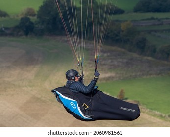 Man Hand Gliding Across The Skies At Westbury White Horse Wiltshire, England On The 10th October 2021