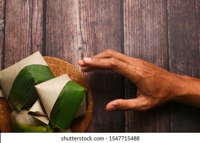 Man Hand Going To Take Malay Traditional Food 