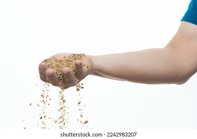 Man Hand hold pour sands of time.Big size Sand flying explosion, Golden grain wave explode. Abstract cloud fly. Yellow colored sand splash throwing in Air. White background Isolated. - Powered by Shutterstock