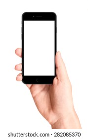 Man hand holding the black smartphone with blank screen, isolated on white background.