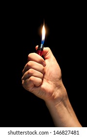 Man Hand Holding Burning Lighter