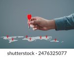 Man hand holding darts with world map. Connecting global travel location technology, Destination points. Map pointer navigation concept, pointing at target of business plan concept, GPS navigator.