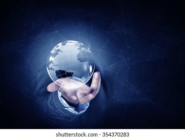 Man hand holding digital Earth planet representing global technologies concept