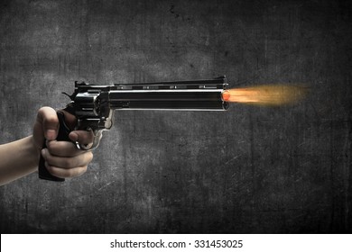 Man Hand Holding Gun And Firing It