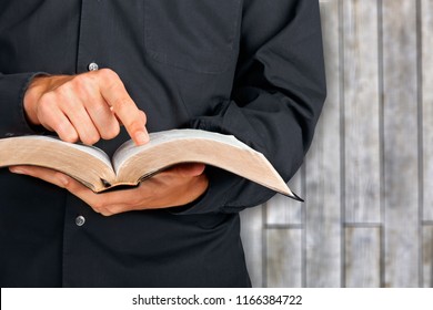 Man Hand Holding Holy Bible