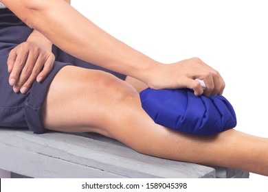  Man hand holding ice bag compress to leg below the knee, relieving pain.isolated on white background.