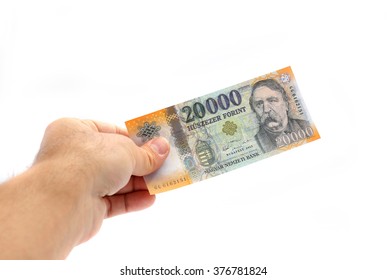 Man Hand Holding The New 20000 Forint Banknote Isolated On White