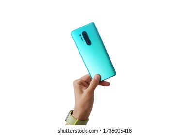 Man hand is holding the newest mint smartphone with triple-camera isolated on white background 