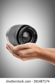Man hand holding object ( camera lens )  High resolution 