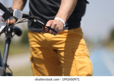 Man Hand Holding Onto Bicycle Steering Wheel