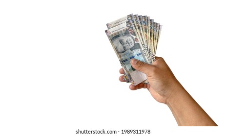 man hand holding peruvian sol banknotes on white background	 - Shutterstock ID 1989311978