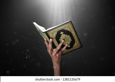 Man Hand Holding Quran Holy Book






































