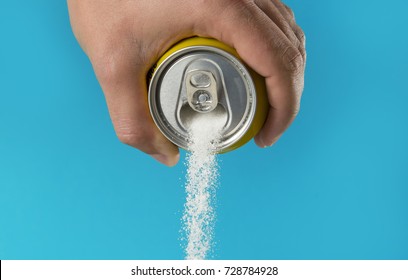 Man Hand Holding Refresh Drink Can Pouring Sugar Stream In Sweet And Calories Content Of Soda And Energy Drinks Concept In Unhealthy Nutrition And Diet Concept