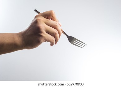 Man Hand Holding A Silver Fork On White Background