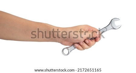 Man hand holding a spanner isolated on a white background