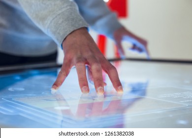 Man Hand Interacting With Large Touch Screen In Museum Exhibition