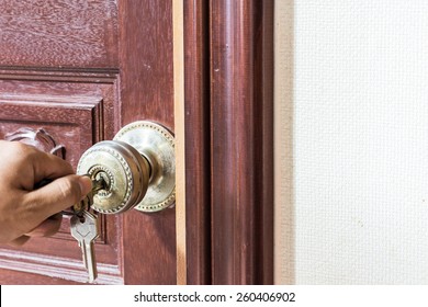 Man Hand Locking The Door