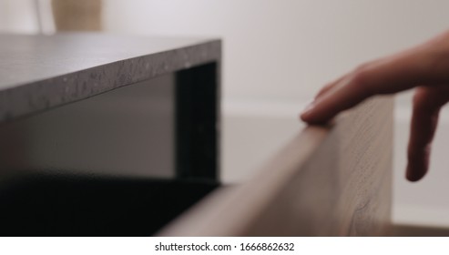 Man Hand Open And Close Batroom Cabinet Drawer Closeup