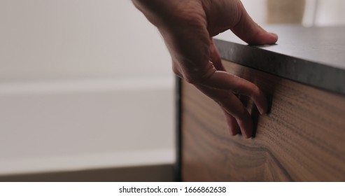 Man Hand Open And Close Batroom Cabinet Drawer Closeup