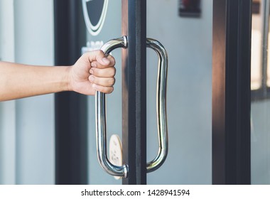 Man Hand Open The Door With Glass Reflection Background