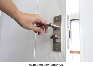 Man Hand Open Doorknob In House.