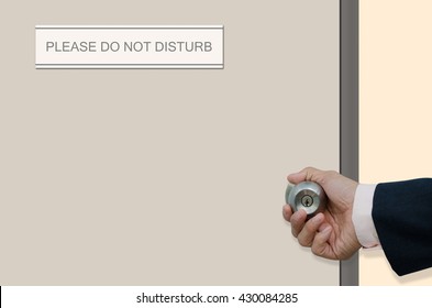 Man Hand Opening The Door Of Room With Label 