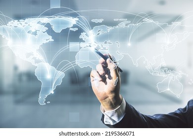 Man hand with pen working with abstract graphic digital world map with connections on blurred office background, globalization concept. Multiexposure - Powered by Shutterstock - Get 15% off with code: PIKWIZARD15