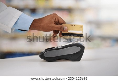 Man, hand and pharmacist with credit card on machine for payment, purchase or swipe in checkout at pharmacy. Hands of person, medical or healthcare expert paying on pos system at pharmaceutical store