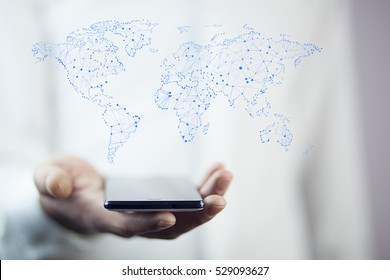 man hand  phone  on  world map