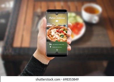 Man Hand With Phone In Restaurant, Ordering Food Online