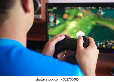Man hand playing a computer games