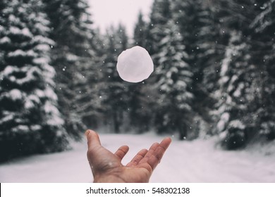 Man hand playing with snowball,winter holiday concept