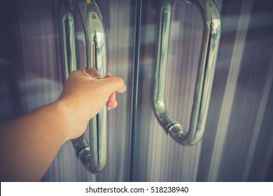 Man Hand Prepare To Open The Door To Entering An Office Background