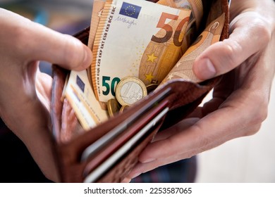 man hand putting money, closeup