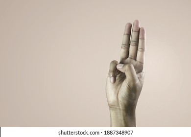 A Man Hand Raised Three Fingers As A Symbol Of Resistance To Dictatorship Or Scout Promise.