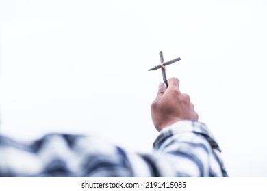 worship hands raised cross