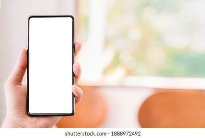 A Man Hand With Red Sweater Are Holding A Mockup Of Vertical Black 5g Mobile Smartphone With Blank White Screen For Insert Your Design, Digital Global Communicate By Smart Phone, Clipping Path Include