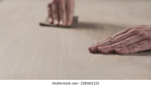 Man Hand Sanding Black Walnut Wood Table, Wide Photo