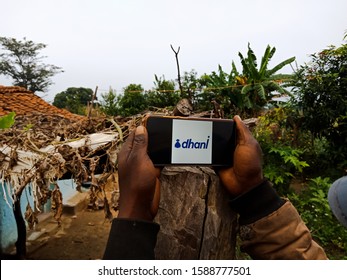 Man Hand Showing Dhani Instant Personal Loan App On Mobile Phone Screen At Village In India Shot Captured On Dec 2019