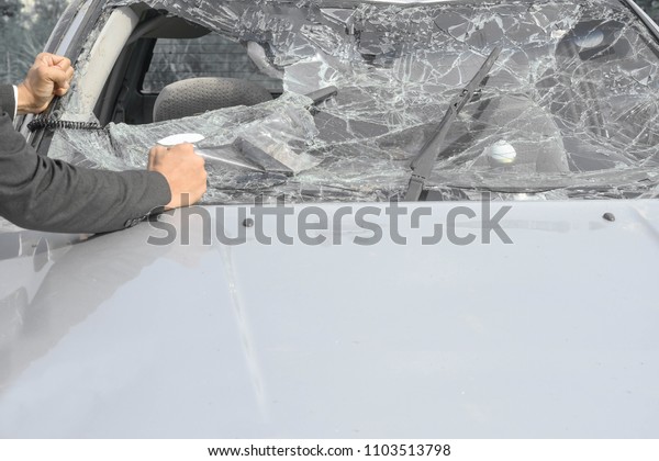 Man hand\
showing feeling bad after a car\
accident