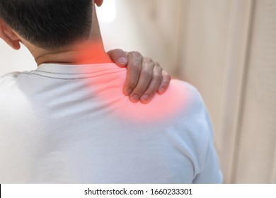 Man With Hand Squeeze At Red Spot Shoulder As Suffering From Pain Or Itchy. Male Hurt At Shoulder And Neck As Sick From Psoriasis,Thoracic Outlet Syndromes, Rotator Cuff Injury,Bursitis,Fibromyalgia