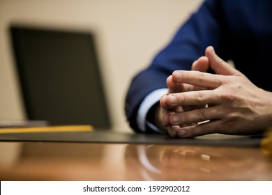 man hand talking in office
